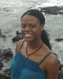 Headshot of Swanne at a rocky beach