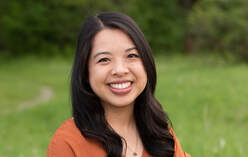 Headshot of Karena in front of grass and trees